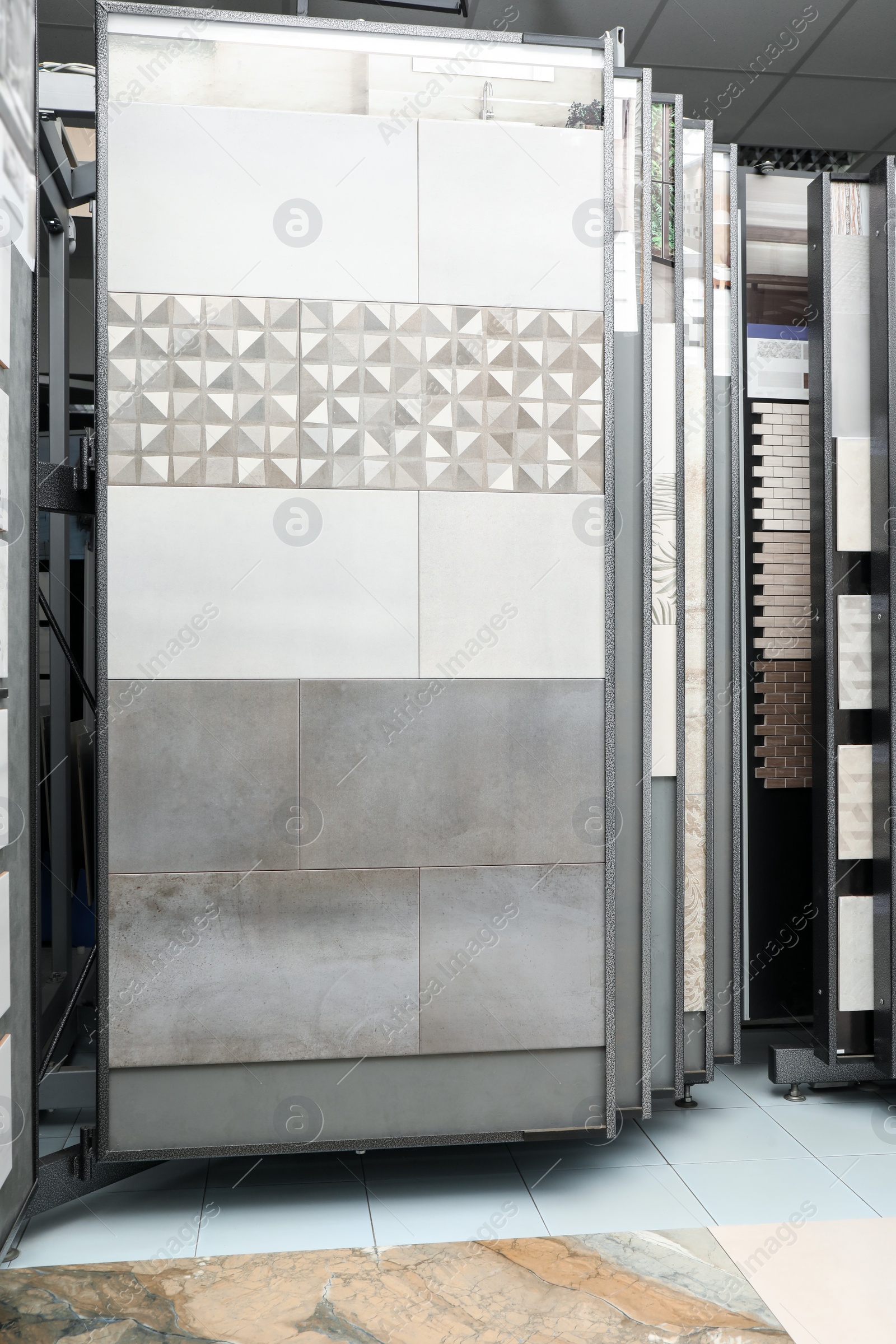 Photo of Many different samples of tiles on display in store