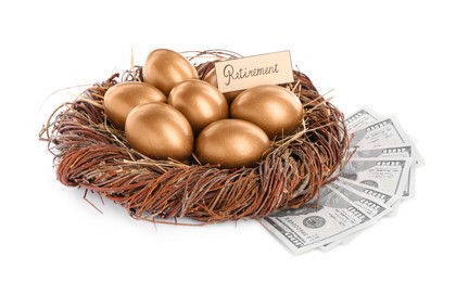 Photo of Many golden and card with word Retirement eggs in nest near money on white background. Pension concept