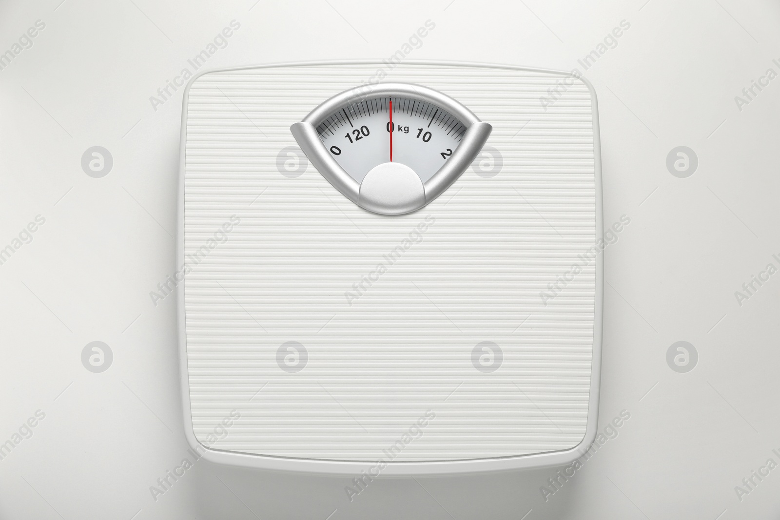Photo of Mechanical scales on white background, top view