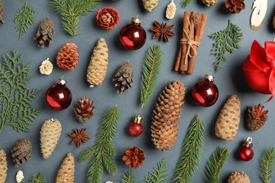 Flat lay composition with pinecones on dark background