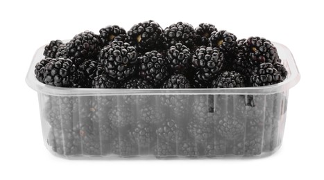 Photo of Tasty ripe blackberries in plastic container isolated on white