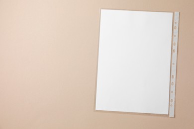 Photo of Punched pocket with paper sheet on light grey background, top view. Space for text