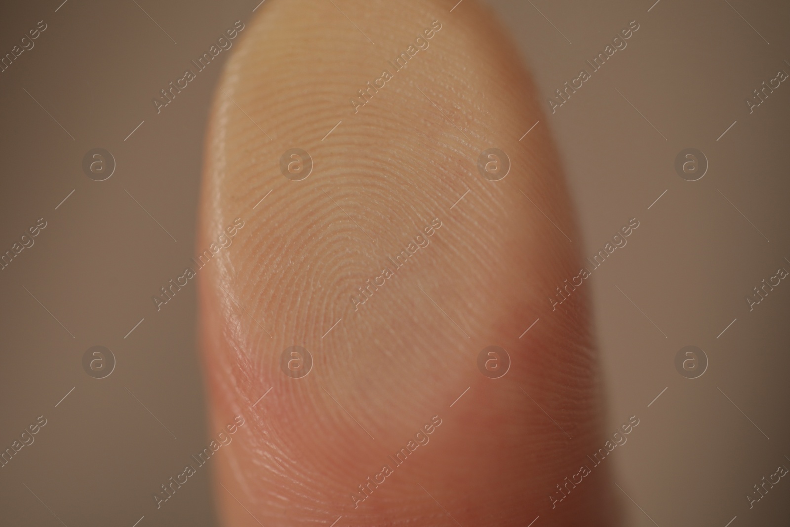 Photo of Closeup view of person scanning fingerprint on blurred background