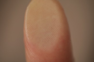 Closeup view of person scanning fingerprint on blurred background