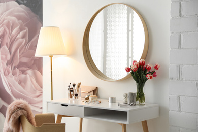 Photo of Stylish room interior with dressing table and mirror