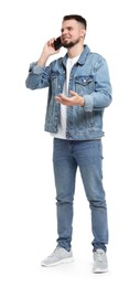 Photo of Man in denim clothes talking on phone isolated on white