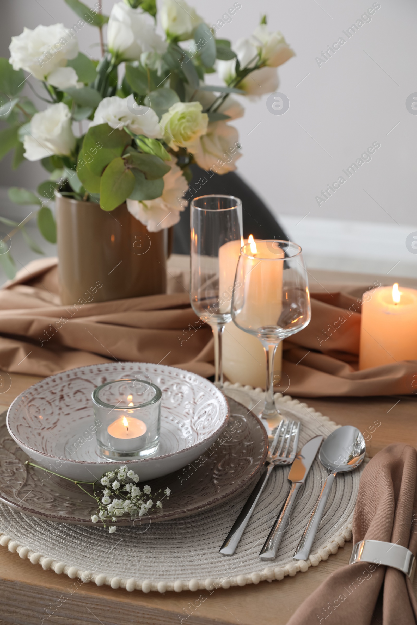 Photo of Festive table setting with beautiful floral decor in restaurant