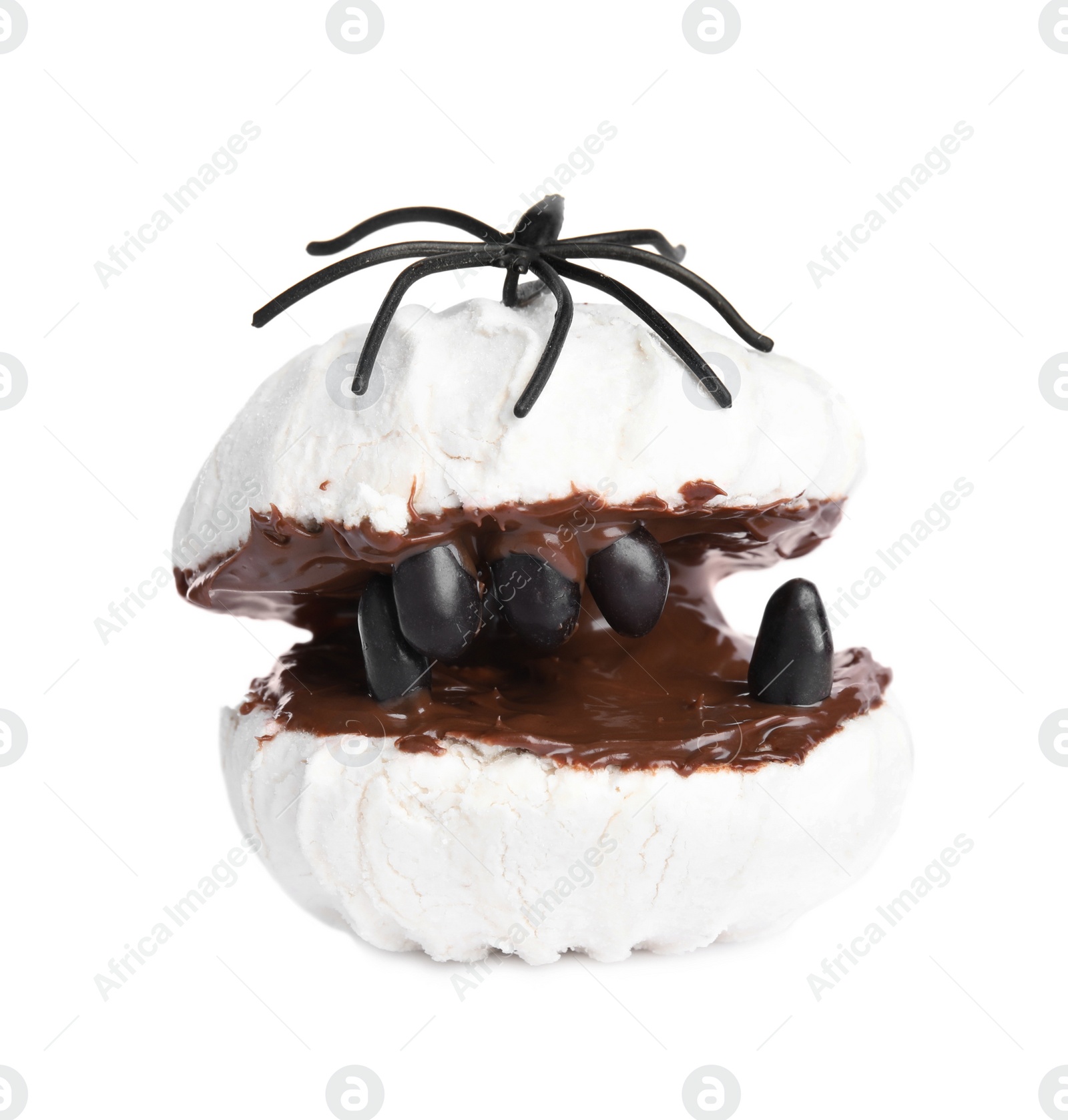 Photo of Delicious dessert decorated as monster on white background. Halloween treat