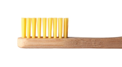 Photo of Toothbrush made of bamboo on white background, closeup