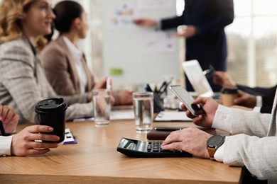 Photo of Businesspeople having meeting in office, closeup. Management consulting