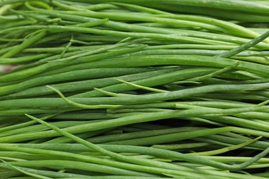 Photo of Fresh green onions as background, top view