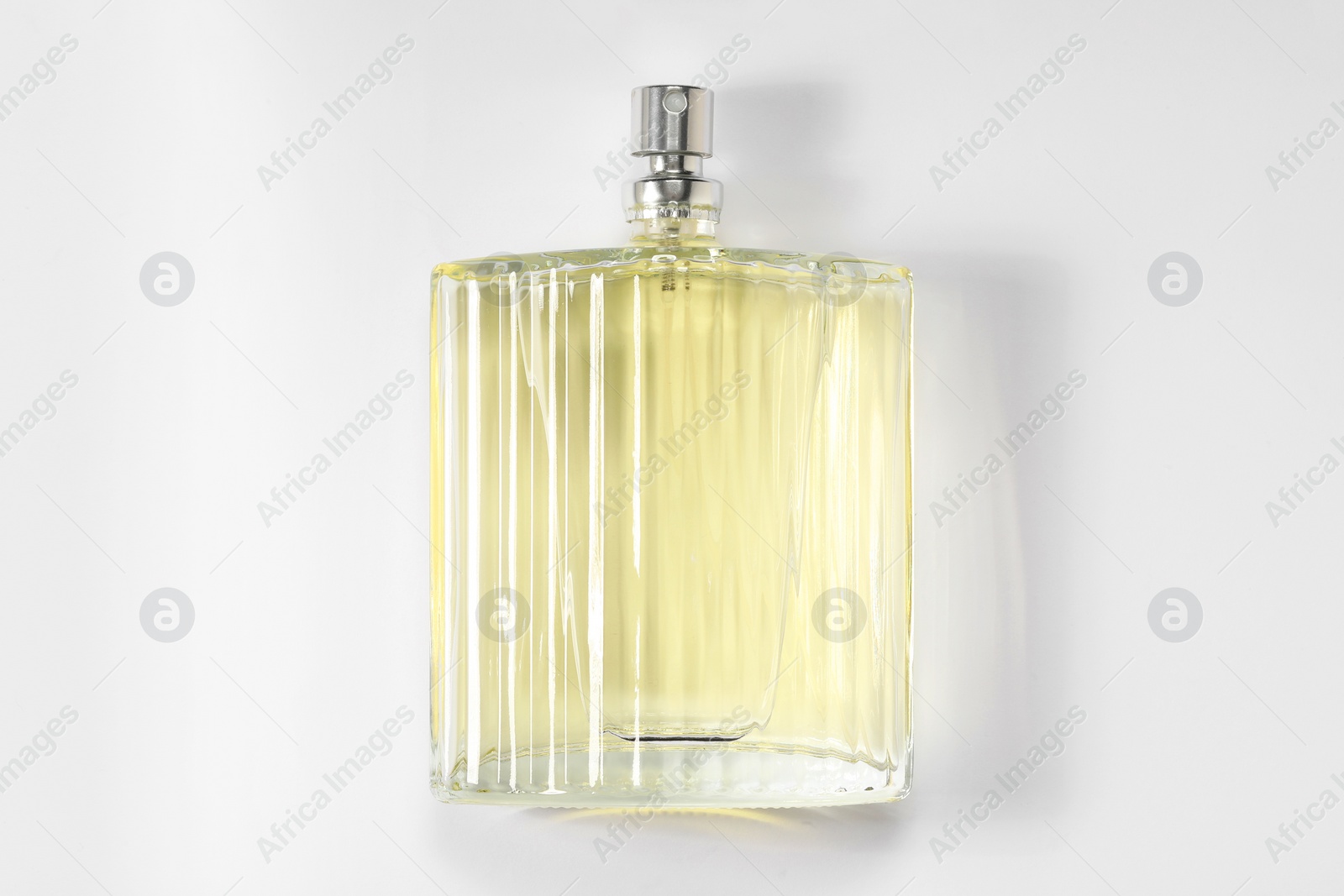 Photo of Luxury men`s perfume in bottle on white background, top view