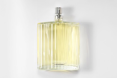 Luxury men`s perfume in bottle on white background, top view