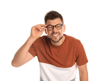 Photo of Man with vision problems wearing glasses on white background