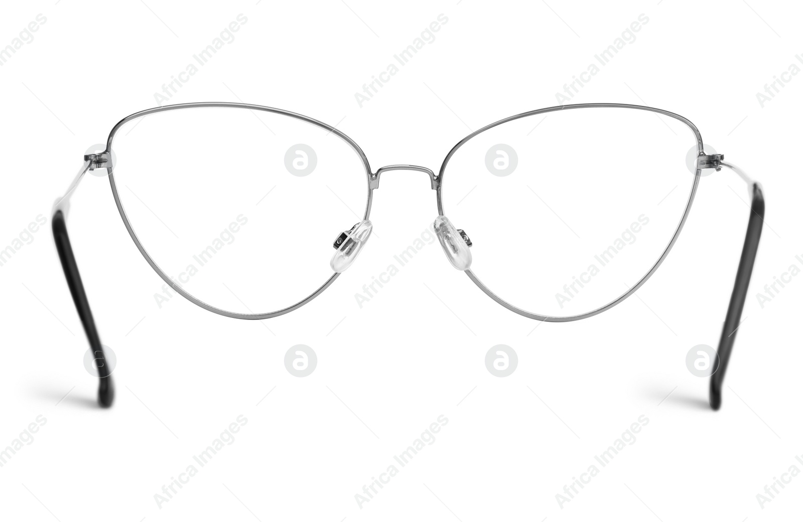 Photo of Stylish glasses with metal frame isolated on white