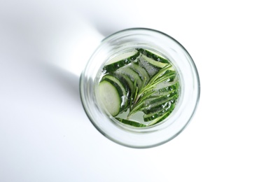 Photo of Glass of fresh cucumber water on white background, top view