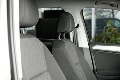 Photo of Modern car interior with comfortable grey seats