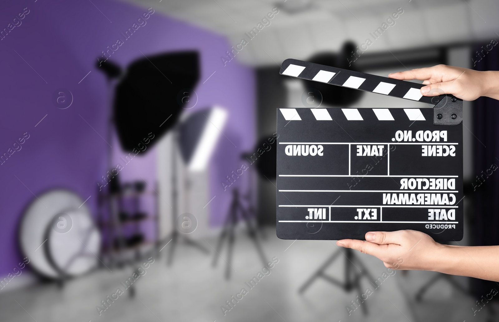 Image of Assistant holding clapperboard on filming location, closeup. Cinema production 