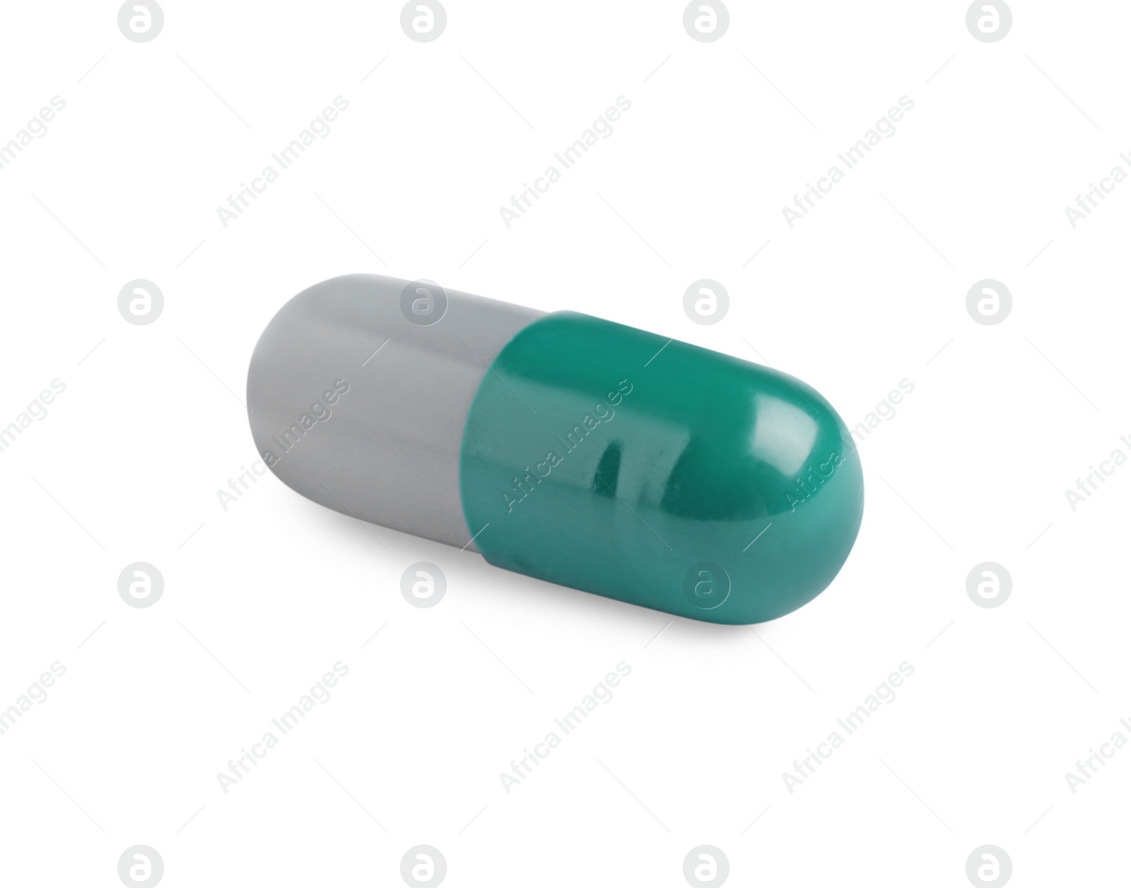 Photo of One pill on white background. Medicinal treatment