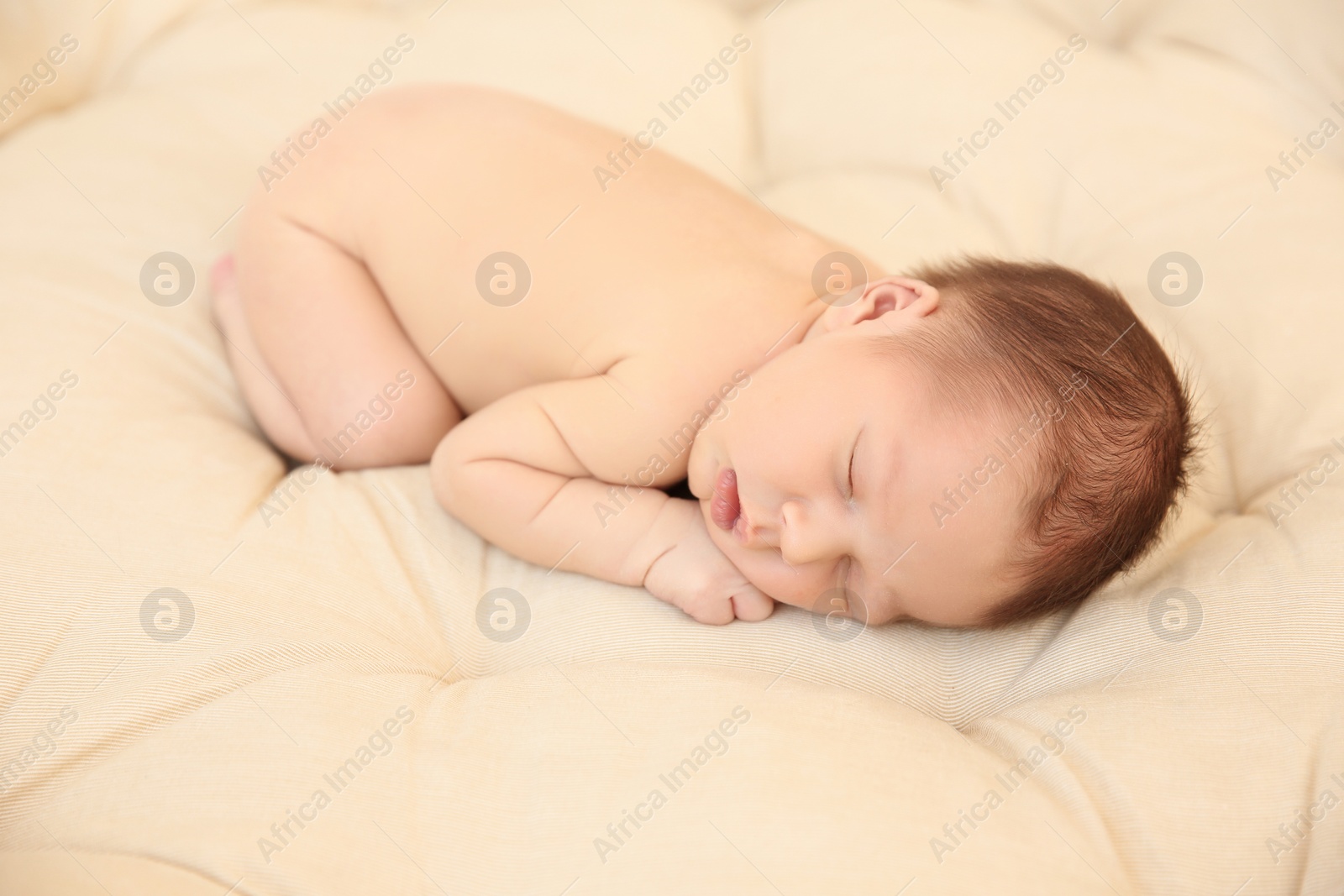 Photo of Adorable newborn baby sleeping on bed