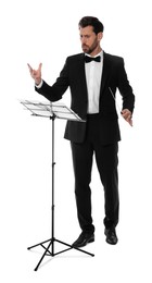 Photo of Professional conductor with baton and note stand on white background