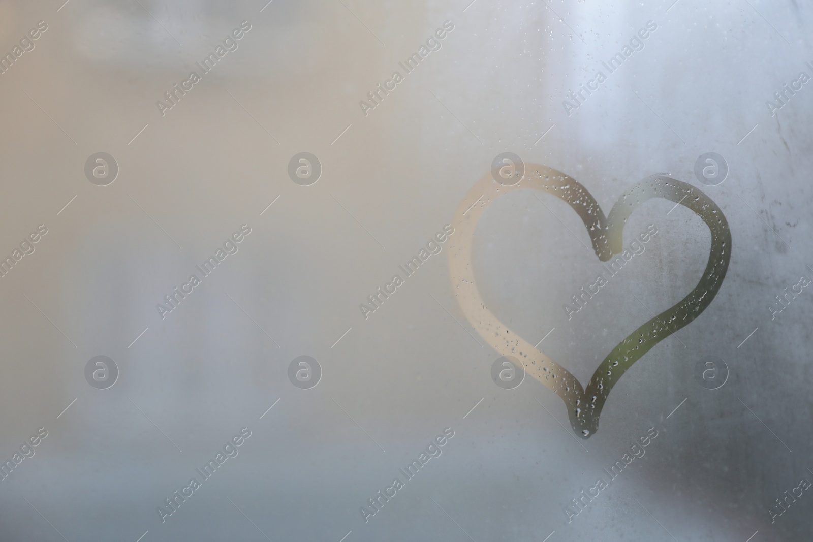 Photo of Heart drawn on foggy window, space for text. Rainy weather