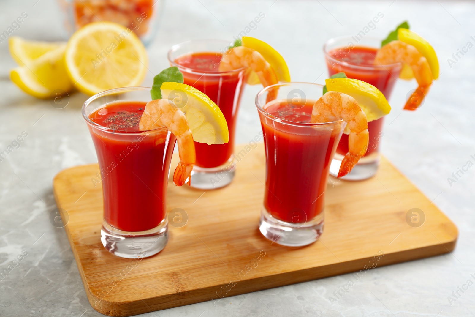 Photo of Delicious shrimp cocktail with tomato sauce served on  table