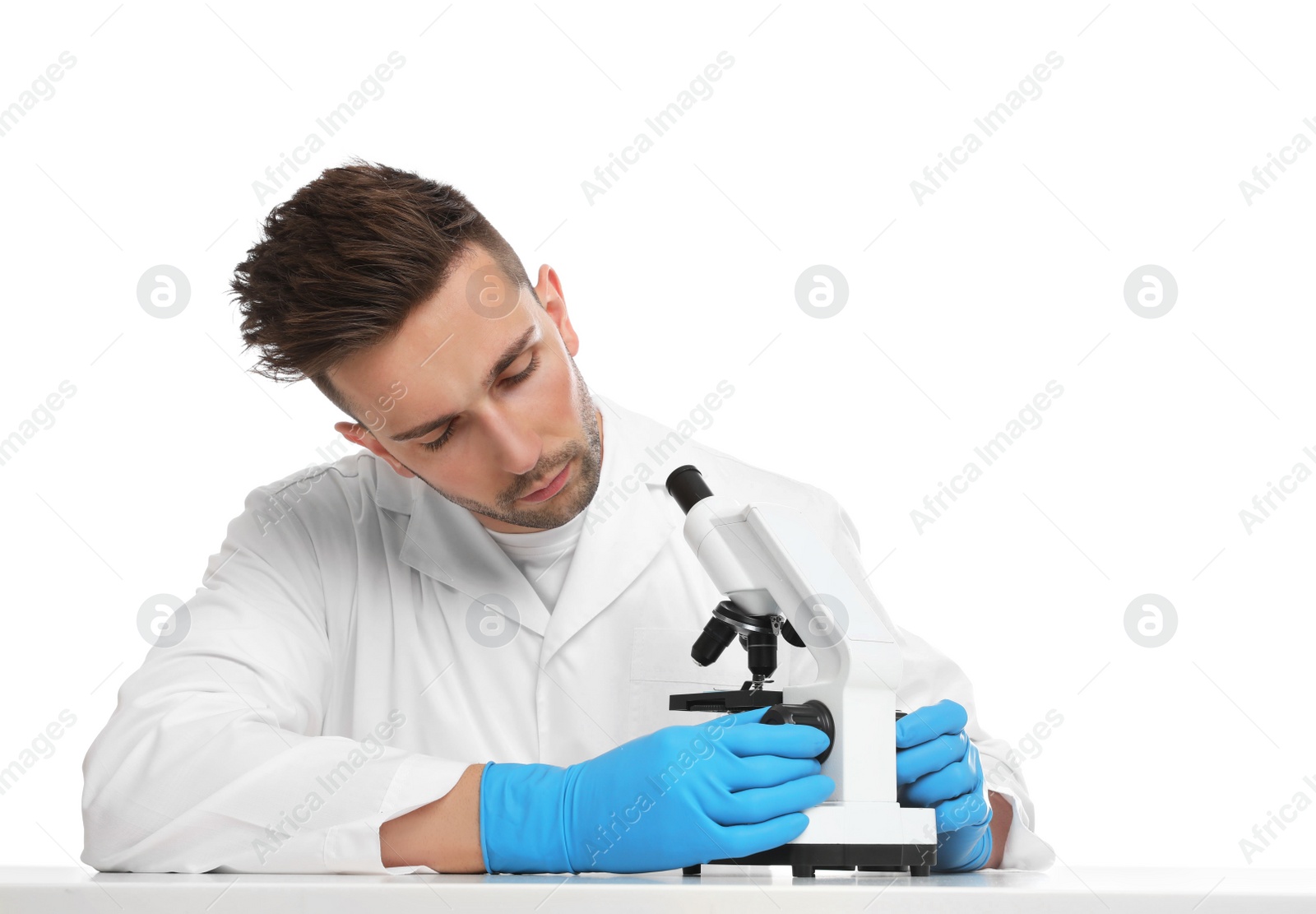 Photo of Scientist using modern microscope at table isolated on white. Medical research