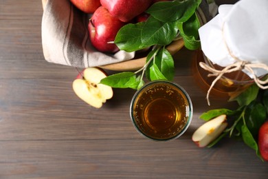 Flat lay composition with delicious apple cider on wooden table, space for text