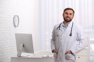 Portrait of pediatrician with stethoscope in clinic