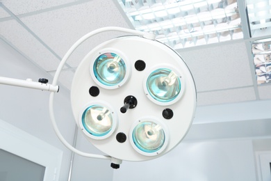 Photo of Powerful surgical lamps in modern operating room
