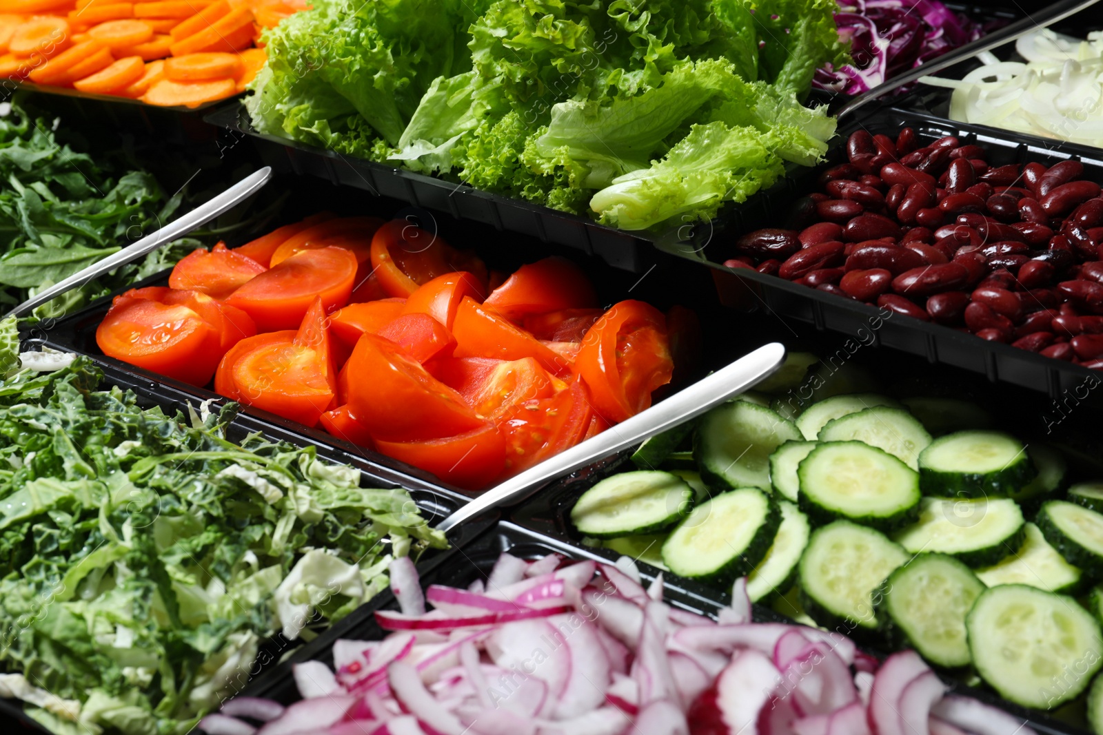 Photo of Salad bar with different fresh ingredients as background