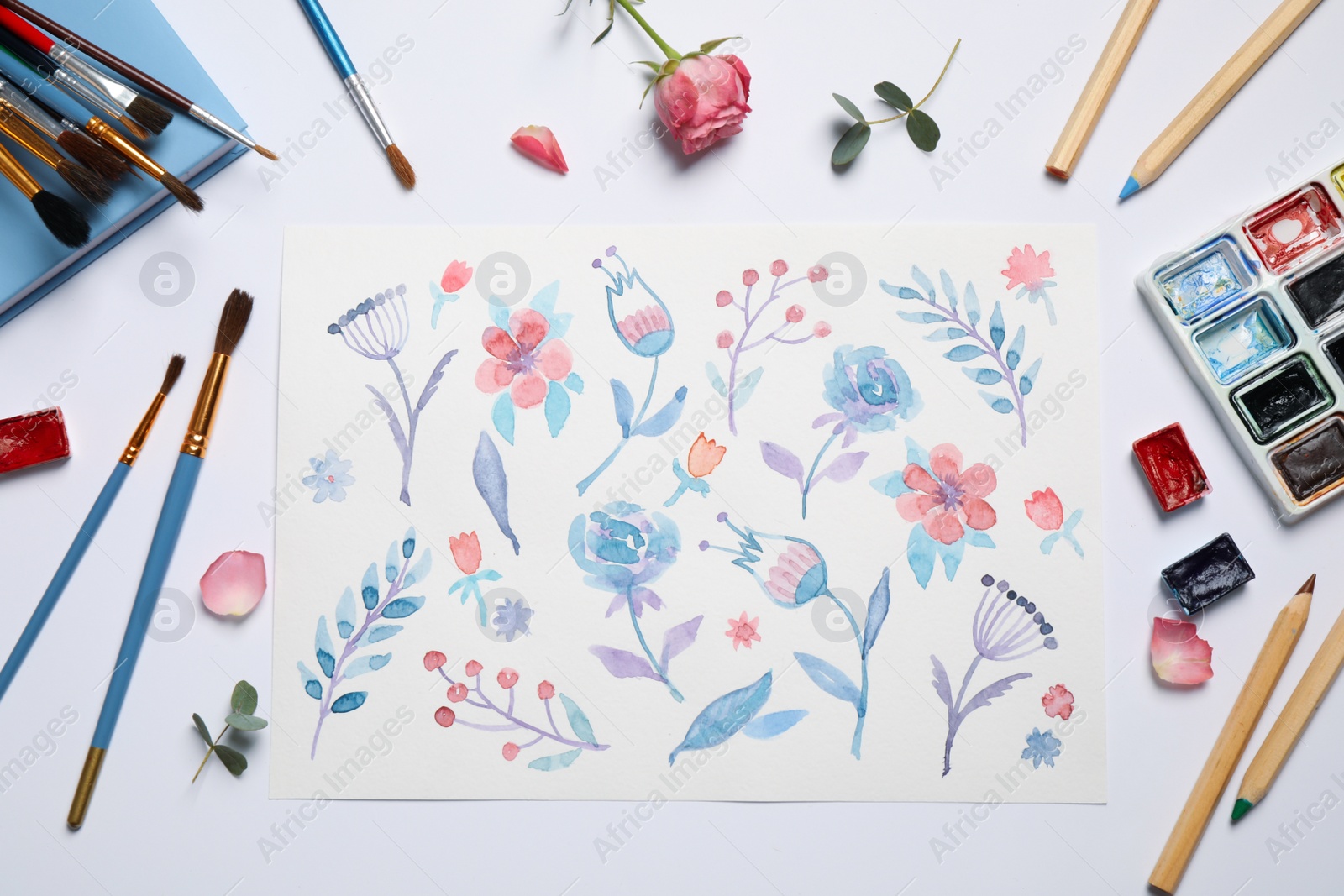 Photo of Flat lay composition with floral picture and watercolor paints on white background