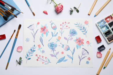 Photo of Flat lay composition with floral picture and watercolor paints on white background