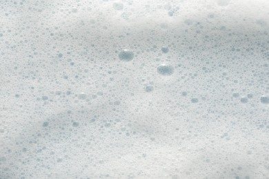 White washing foam as background, top view