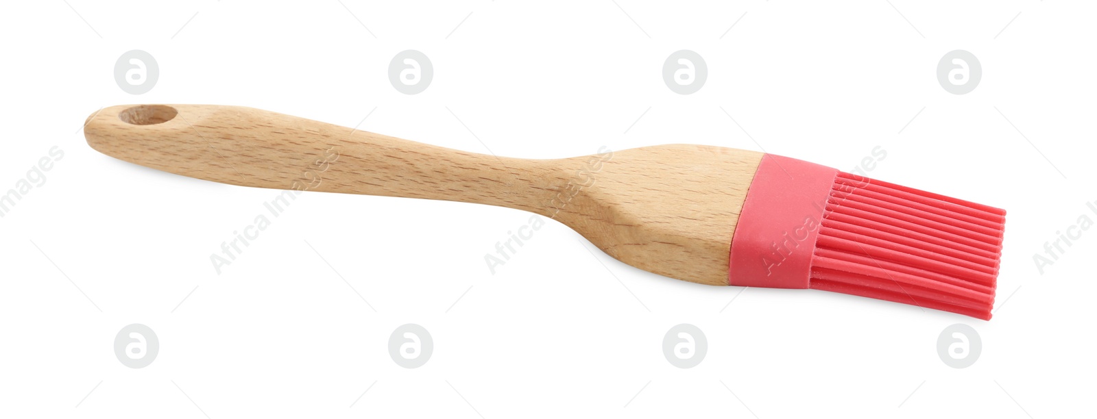 Photo of Red silicone brush with wooden handle isolated on white. Cooking utensil
