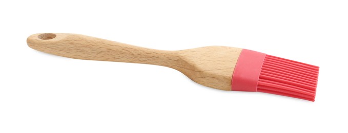 Photo of Red silicone brush with wooden handle isolated on white. Cooking utensil