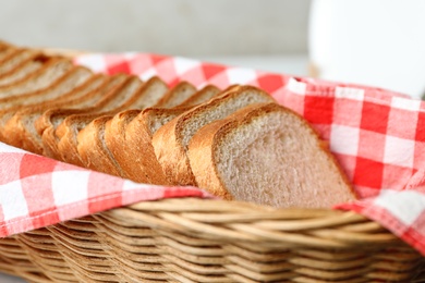 Photo of Slices of fresh bread in basket, closeup