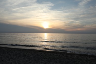 Picturesque view of sea and tropical beach at sunset