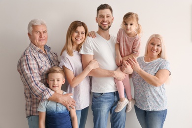 Photo of Happy family with cute kids on light background