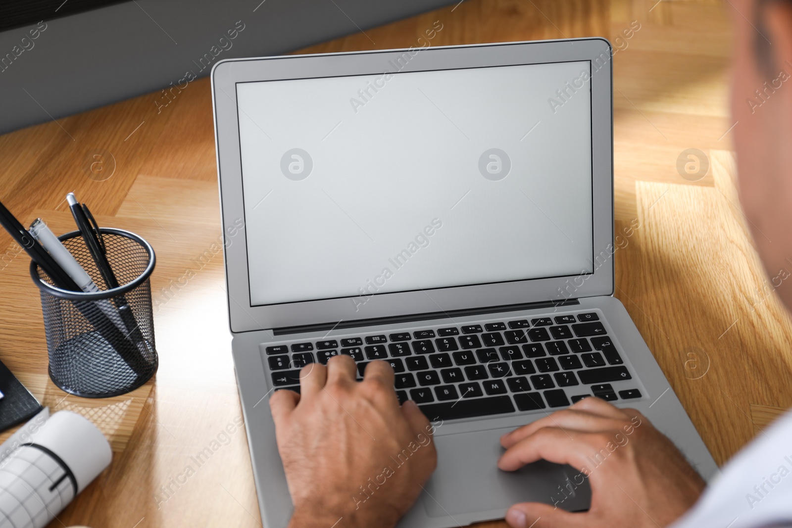 Photo of Coworkers working together online. Man using video chat on laptop, closeup