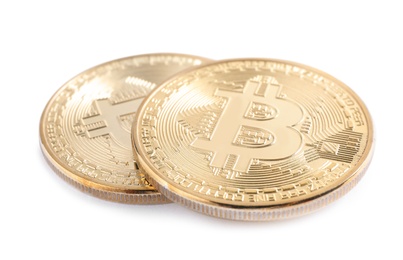 Photo of Shiny bitcoins isolated on white. Digital currency