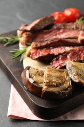Delicious grilled vegetables and beef on grey table, closeup