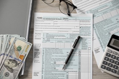 Photo of Payroll. Flat lay composition with tax return forms on wooden table