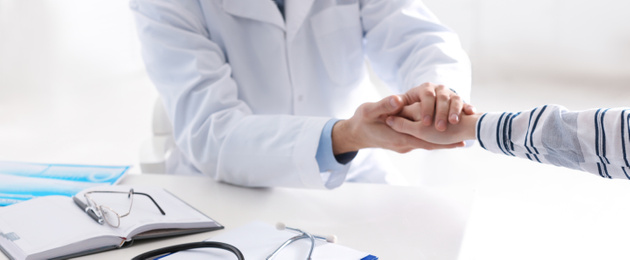 Doctor consulting patient at desk in clinic, closeup. Banner design