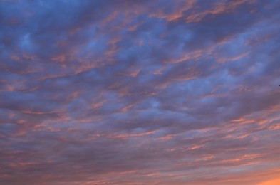 Picturesque view of cloudy sky lit by sunset