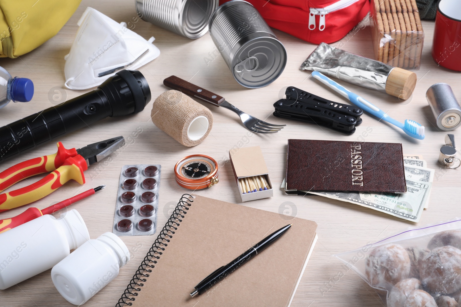 Photo of Disaster supply kit for earthquake on wooden table