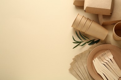 Photo of Flat lay composition with eco friendly products on beige background, space for text