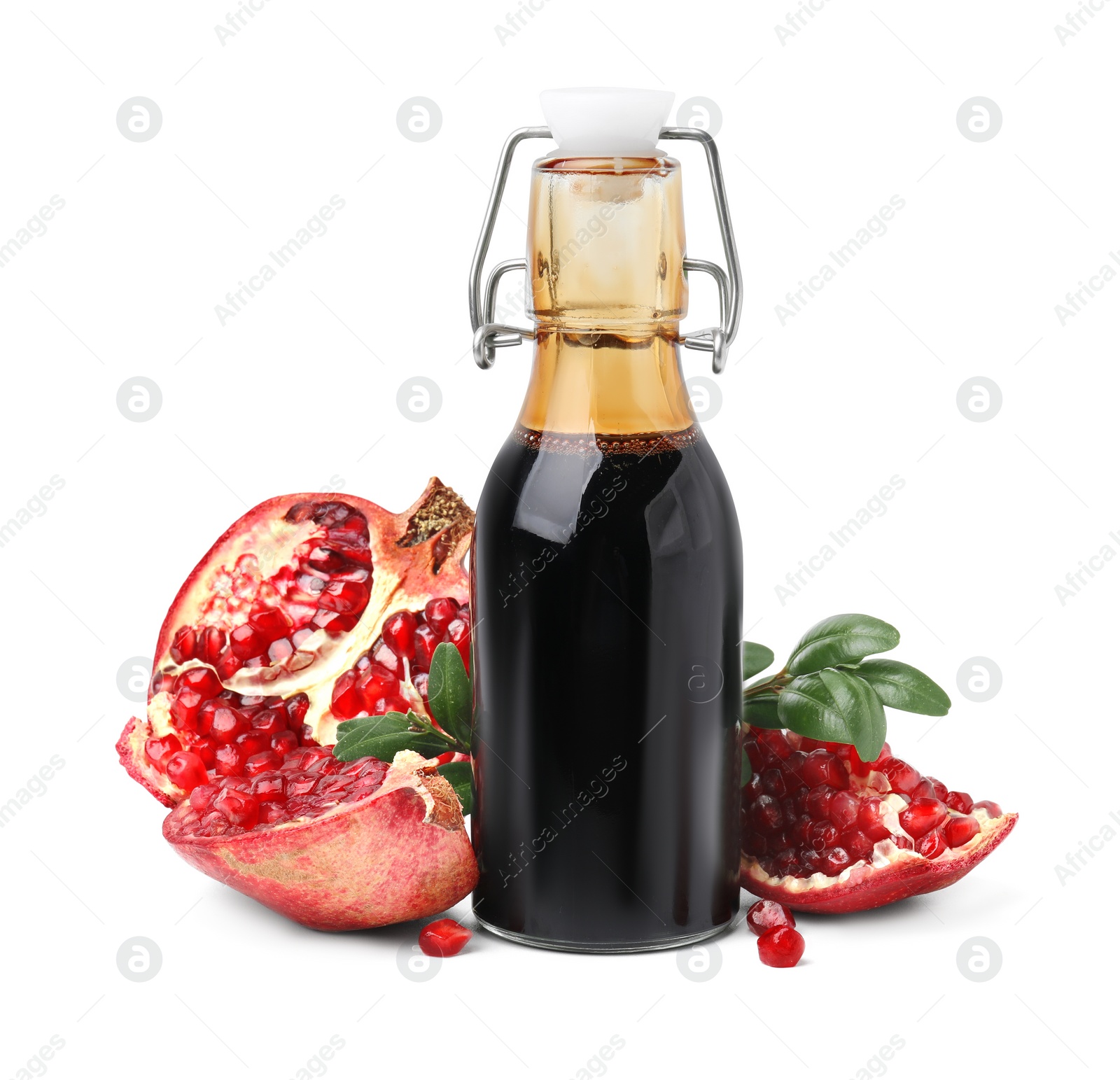 Photo of Tasty pomegranate sauce in bottle, fruits and branch isolated on white