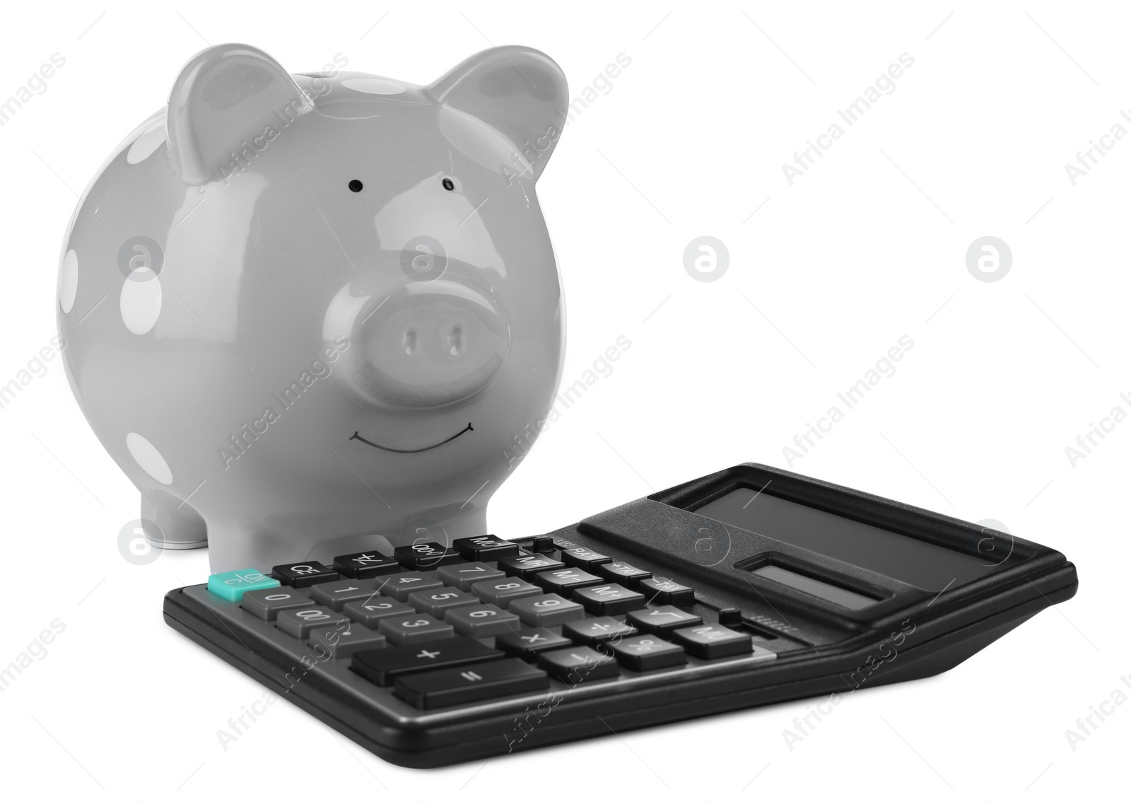 Photo of Calculator and grey piggy bank isolated on white